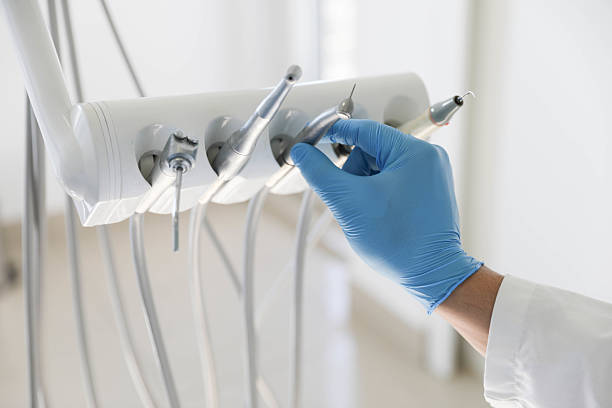 Professional Tooth Extraction technician working in Gulf Hills, MS